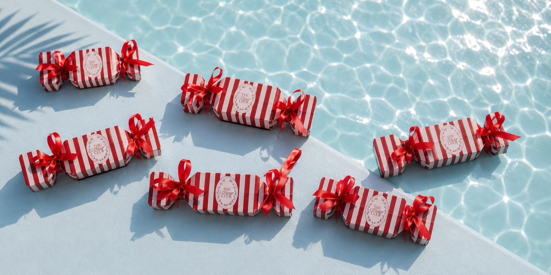 The Hair Club gift boxes by the pool