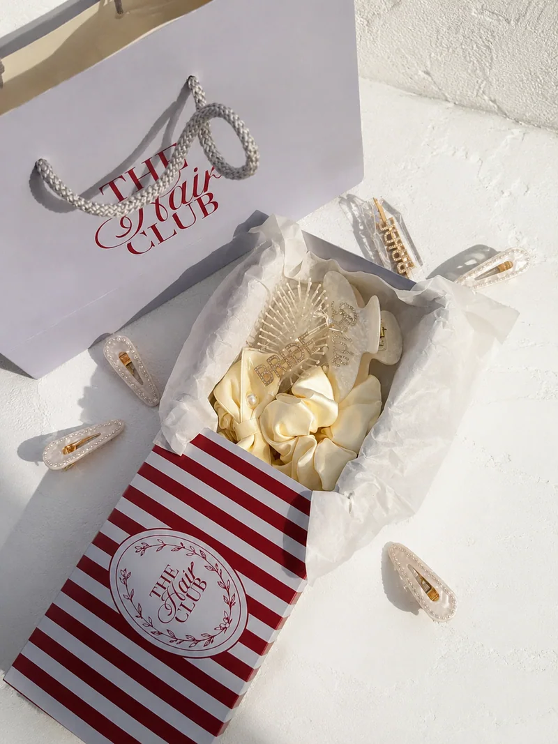 The Hair Club gift box and accessories in sunlight